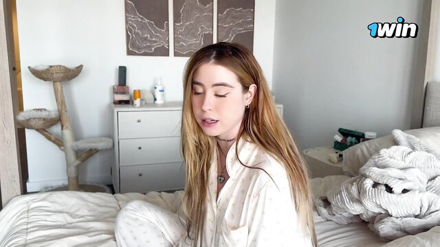 Rosie in silky white shirt on bed, hot blonde amateur tease