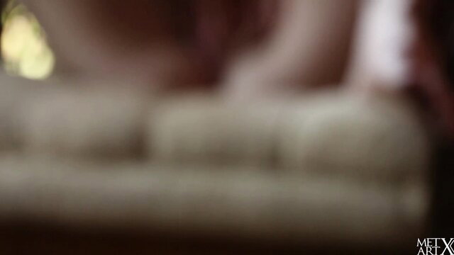 Blonde Lena Anderson topless on couch in sexy upskirt pose