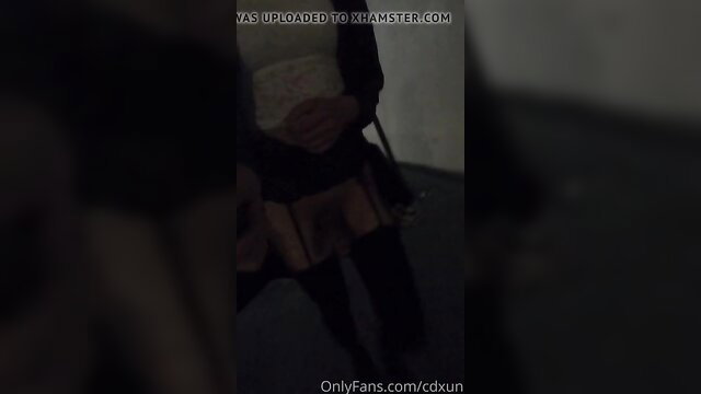 Asian trans girl in plaid skirt and stockings poses seductively