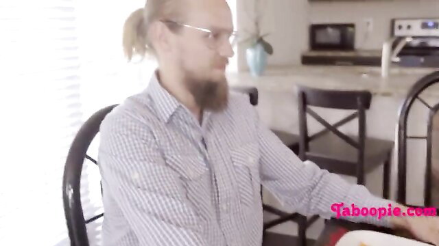 Man with ponytail beard at family table, naughty taboo vibes