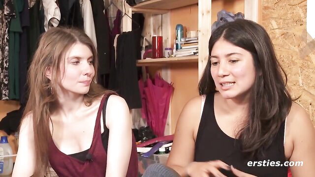 Two hot girls in tank tops chat intimately in amateur lesbian preview