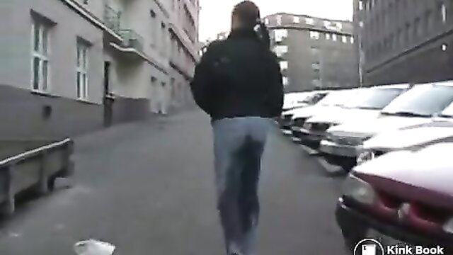 Dany wetting jeans in public street, wet pants visible from behind