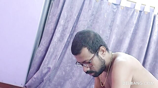 Nude Desi man with glasses kneels bare in amateur Indian video thumbnail