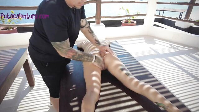 Tattooed guy massages hot girl's thighs in outdoor erotic session