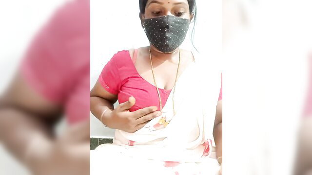 Renuma in tight pink blouse, hand on cleavage, saree tease