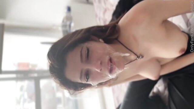 Brunette deepthroating cumshot on face in room closeup