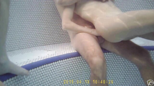 Naked young couple fucking underwater in pool closeup