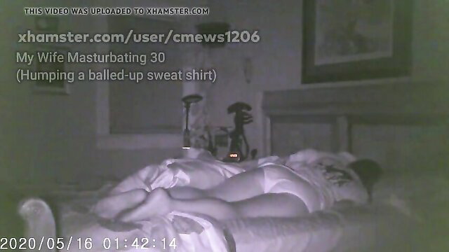 Hot wife masturbating by humping balled-up sweatshirt on bed