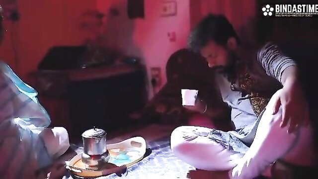 Indian yoga teacher in white saree with bearded man sipping tea hot scene