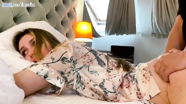 Youthful guy gropes busty stepmom's ass on hotel bed