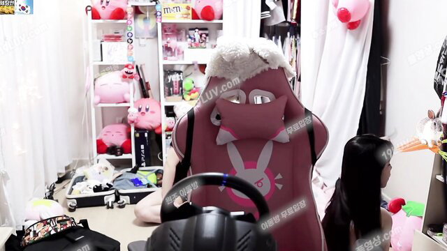 Korean gamer girl in pink bunny chair, long black hair, gaming setup leak