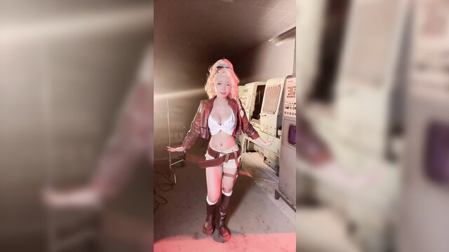Blonde Gemma Monster Hunter Wilds cosplay in leather jacket, bikin, thigh highs