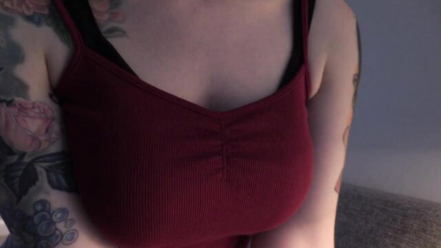 Bettie Bondage tattooed cleavage in tight red top, romantic POV