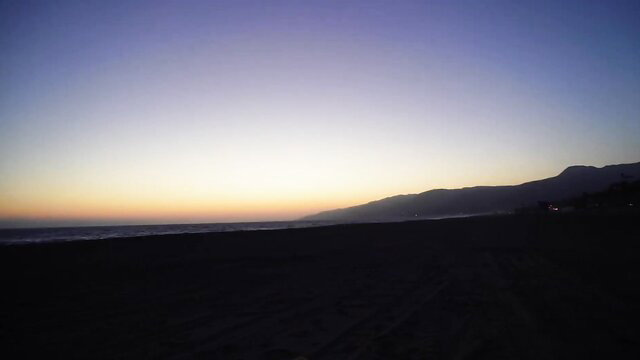 Muscle mommy certified fitness babe on LA beach sunset silhouette