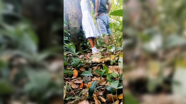 Outdoor jungle fuck: beautiful schoolgirl in white dress with boyfriend