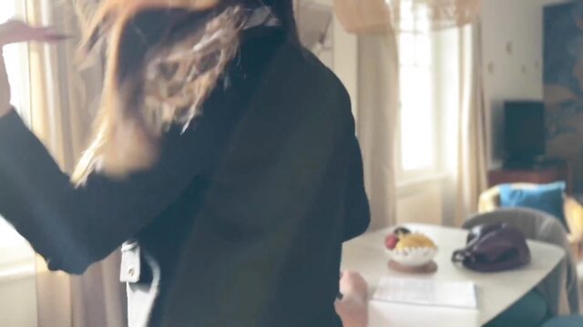 Blonde in black blazer twirls hair over table in hot amateur tease