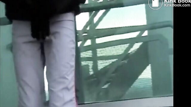 Woman in tight white pants messy accident on public balcony railing