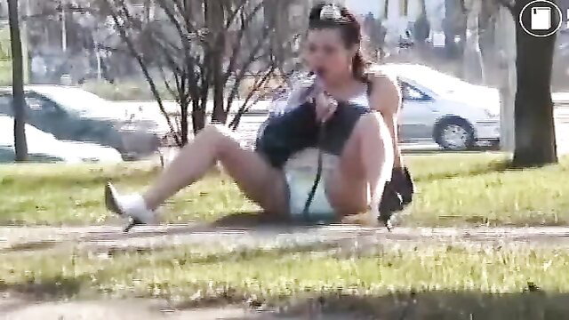 Dany in diaper exposed legs spread public park outdoor fetish