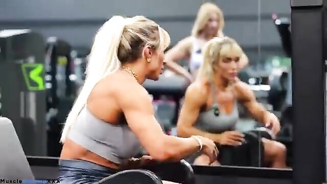 Blonde fitness babes with huge muscles working out at gym