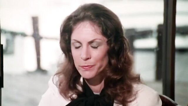 Vintage 1980s brunette MILF in white blouse black neckerchief closeup