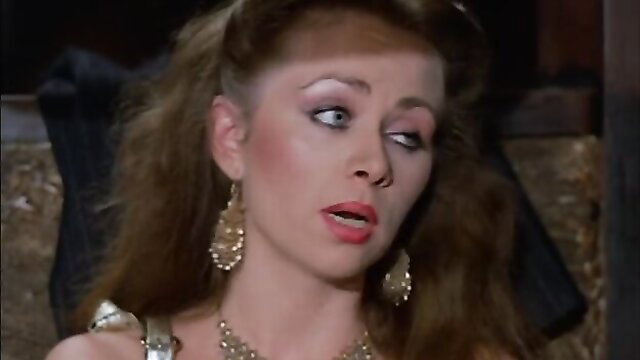 Vintage 1982 porn star in gold jewelry with shocked expression