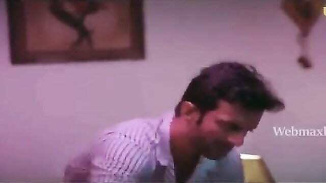 Indian man in striped shirt smirking intimately in Aah se Aaha Tak Ullu scene