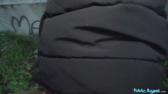 Martin Gun in puffy jacket outdoors by graffiti wall, Fake Hub