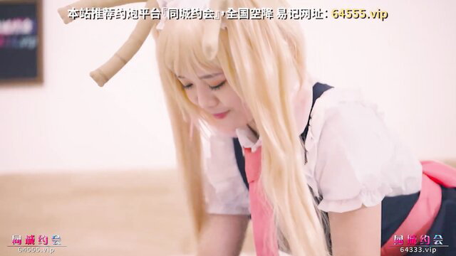 Blonde Tohru cosplay girl in sexy sailor uniform kneeling seductively