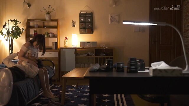 Asian beauty in sheer lingerie sits on bed in cozy room, Sis-con JAV