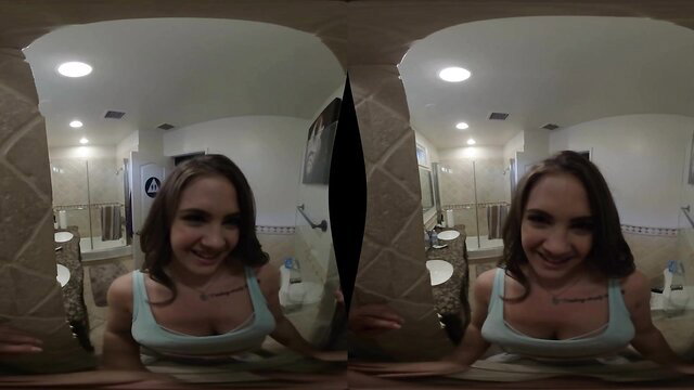 Cute brunette smiling in tank top, cleavage tease in bathroom