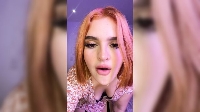 Silvi with magnetic ass in low-cut floral dress, pink hair, seductive close-up pout