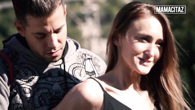 Hot Latina with smiling guy embracing outdoors in MamacitaZ scene