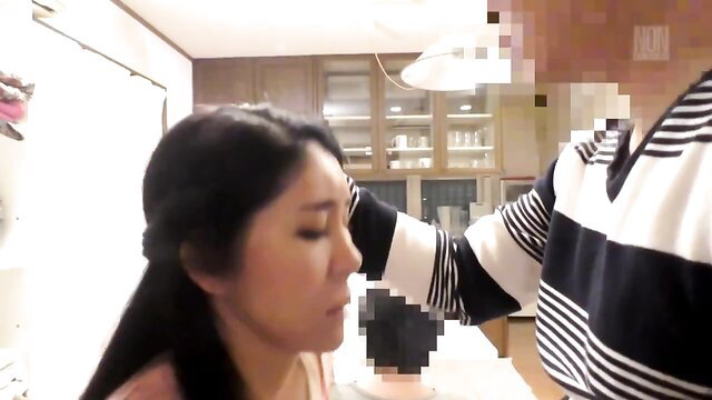 Asian mom Miyuki in kitchen with son's arm, JAV incest tease