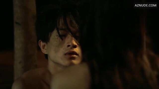 Closeup of handsome Asian man with wet hair in steamy nude embrace