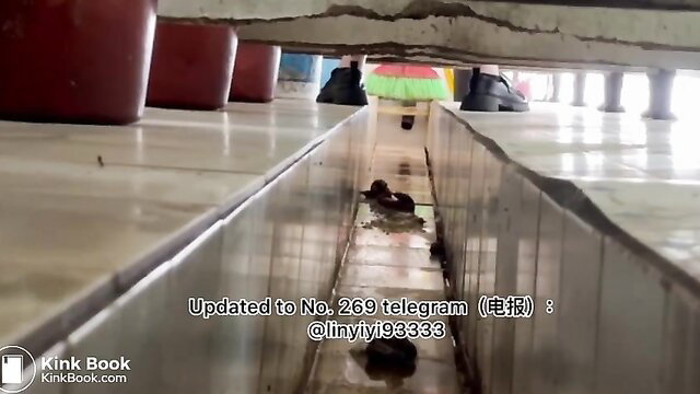 Beautiful Asian girl squatting poops in open gutter drain toilet