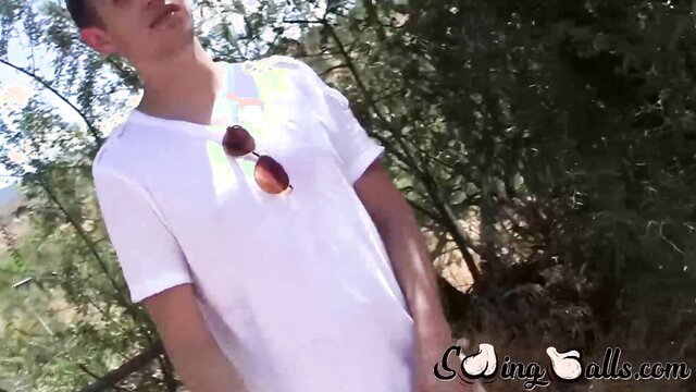 Oliver Dean strokes cock outdoors in white V-neck shirt