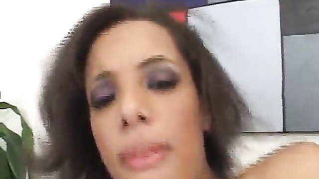 Closeup of cute mixed ebony babe with purple eyeshadow lips parted ready for action