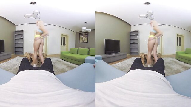 Sabrina blonde in yellow lingerie stands over POV cock on bed