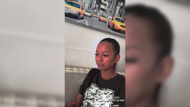 Miiana model closeup in black tee, NYC backdrop, adult challenge thumbnail