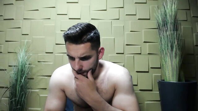 Hot muscular Arab guy thinking nude, powerful smile gay cam show