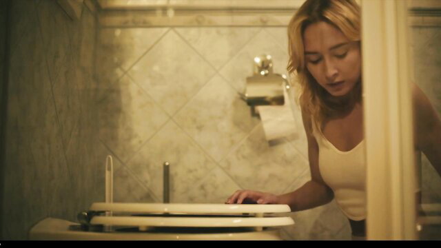 Kelly Collins in tank top bending over toilet in Parasited 911 Please