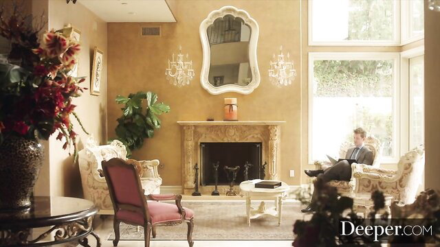 Khloe Kapri in luxurious living room, seductive pose