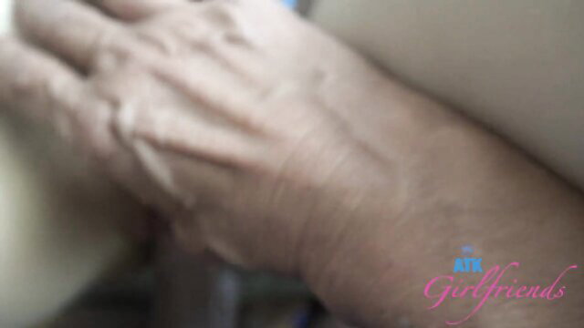 Amber Angel's wrinkled hand gripping hard dick in homemade foot fetish vid