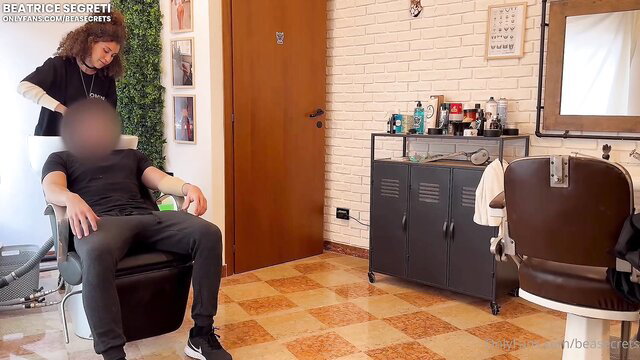 Beatrice Segreti cutting customer's hair in barber shop