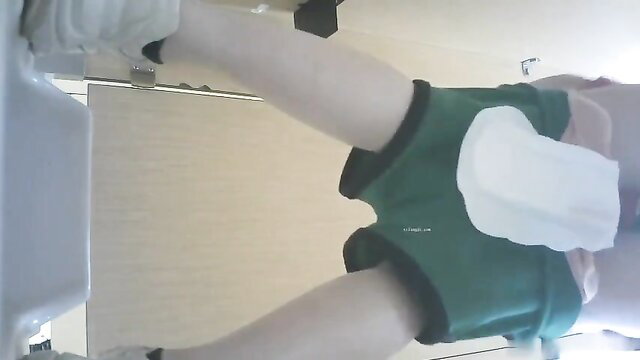 Chinese amateur toilet voyeur upskirt of slim legs in green shorts with tissue