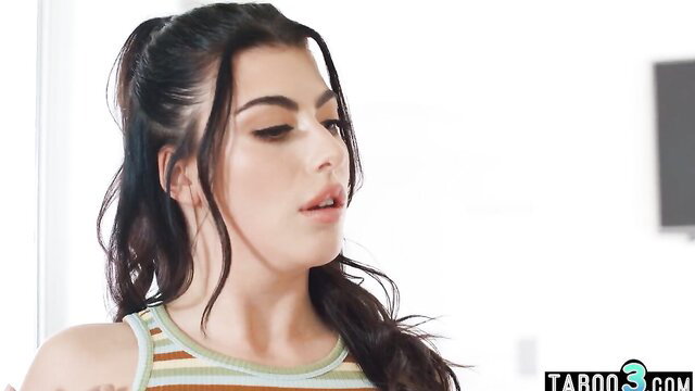 Kenzie Taylor closeup in striped tank top, seductive gaze