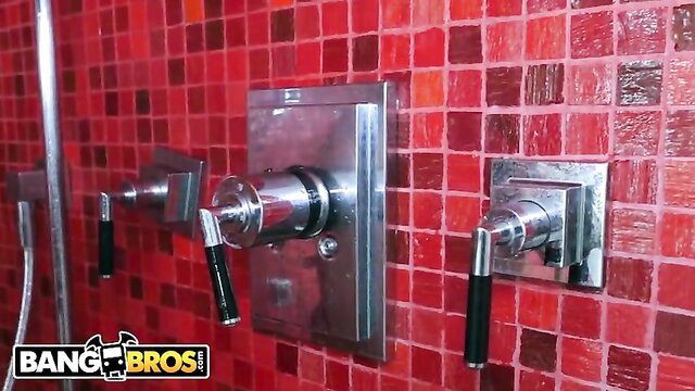 BangBros red mosaic shower wall with chrome faucets and handles