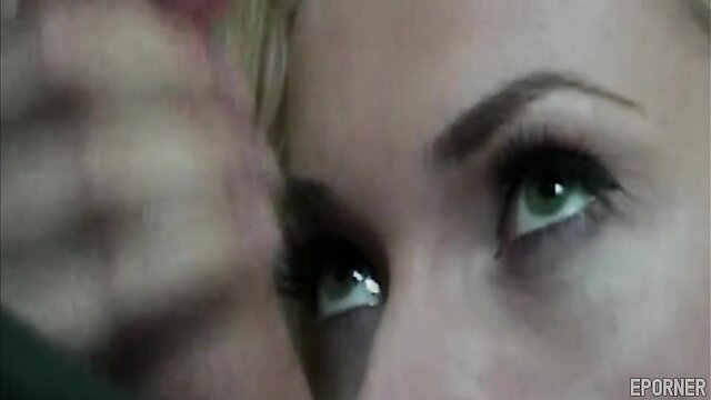 Ava Vincent's intense green eyes close-up in hardcore scene
