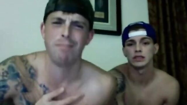 Two sexy horny tattooed white buddies shirtless smirking closeup