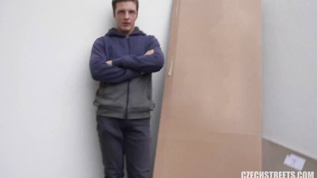 Czech Streets guy in hoodie and track pants stands arms crossed